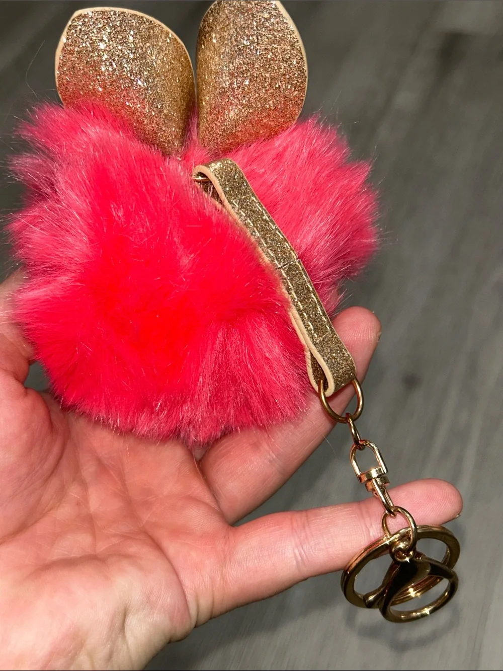 Pink Fuzzy Furby Pom Pom Keychain wearing glasses with Gold Accents